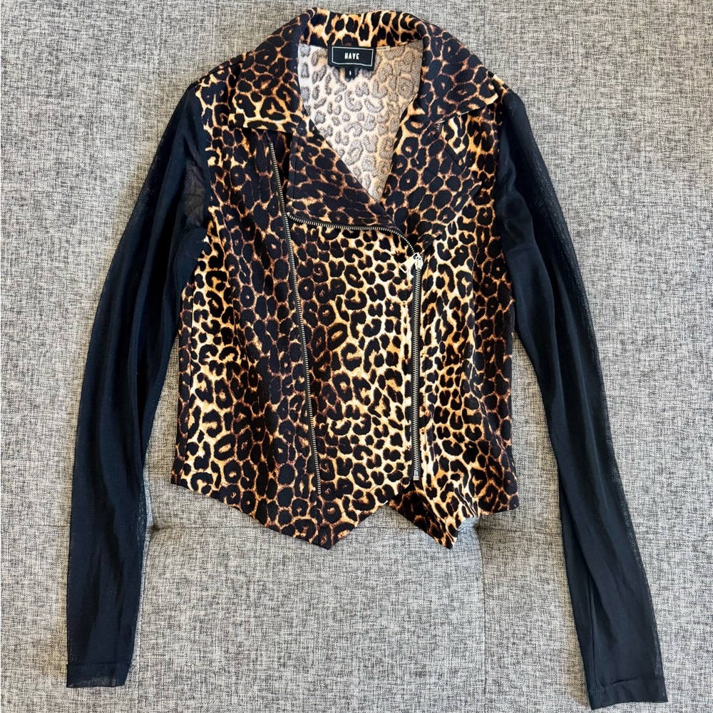 Have Leopard print zip-up top with black sheer sleeves.